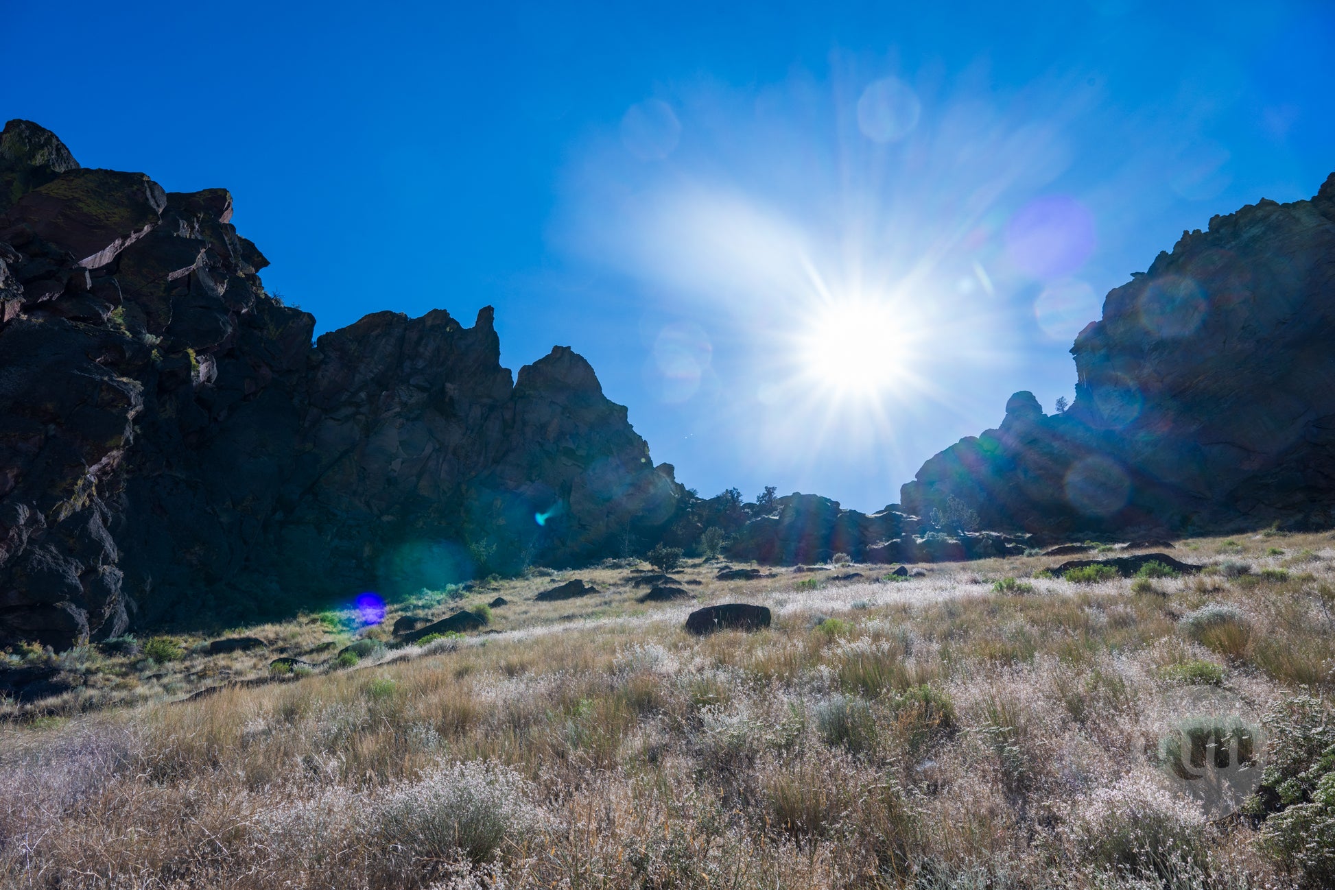Rugged landscape with rocky formations and a clear blue sky