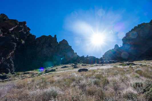 Rugged landscape with rocky formations and a clear blue sky
