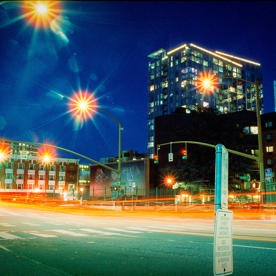 City street at night with traffic lights and buildings
